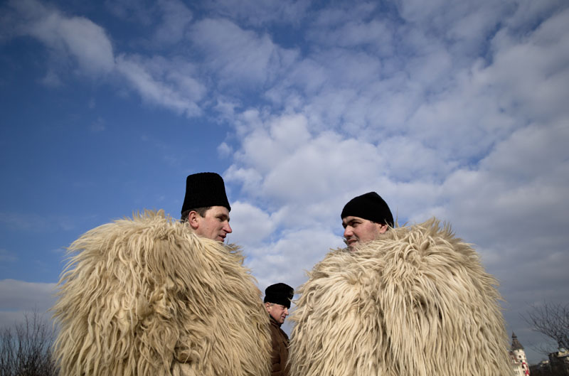 Shepherds talk during a protest in Bucharest, Romania on Tuesday, Dec. 15, 2015. Photo: AP