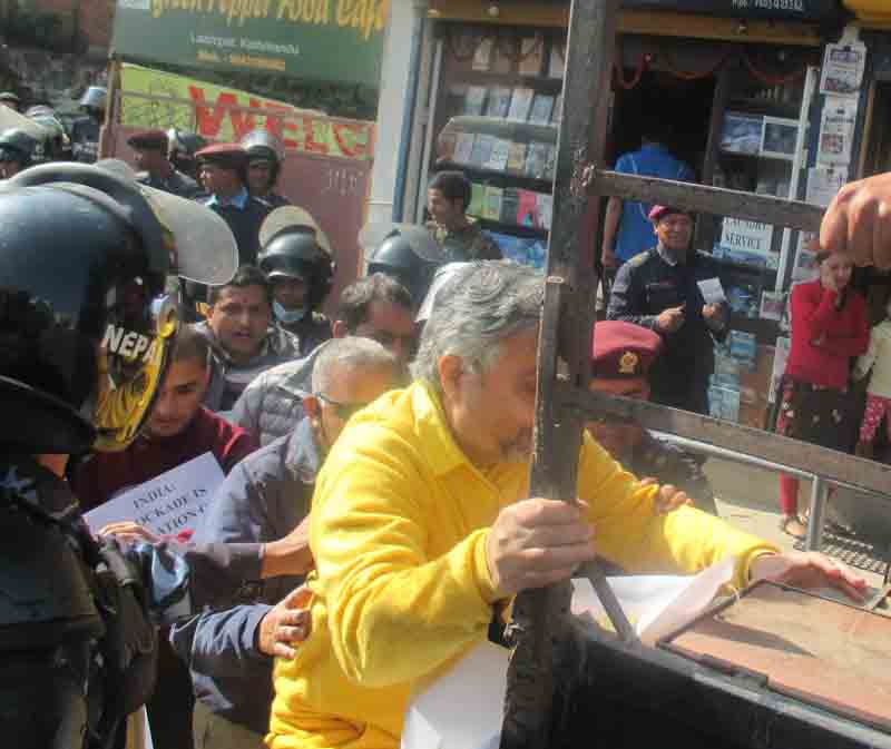 Veteran human rights activist Krishna Pahadi being detained by police in front of the Indian Embassy in Lainchaur of Kathmandu on Thursday, December 3, 2015. Photo: HURPES