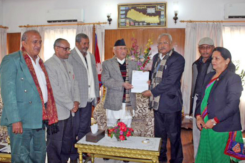 A team led by MJF-Democratic Chairman and Deputy Prime Minister, Bijay Kumar Gachchhadar, submitting a memorandum to Prime Minister KP Sharma Oli in his official residence at Baluwatar, on Tuesday, December 15, 2015. Photo: RSS