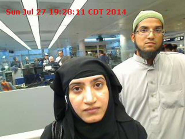 Tashfeen Malik, (L), and Syed Farook are pictured passing through Chicago's O'Hare International Airport in this July 27, 2014 handout photo obtained by Reuters December 8, 2015. Photo: REUTERS