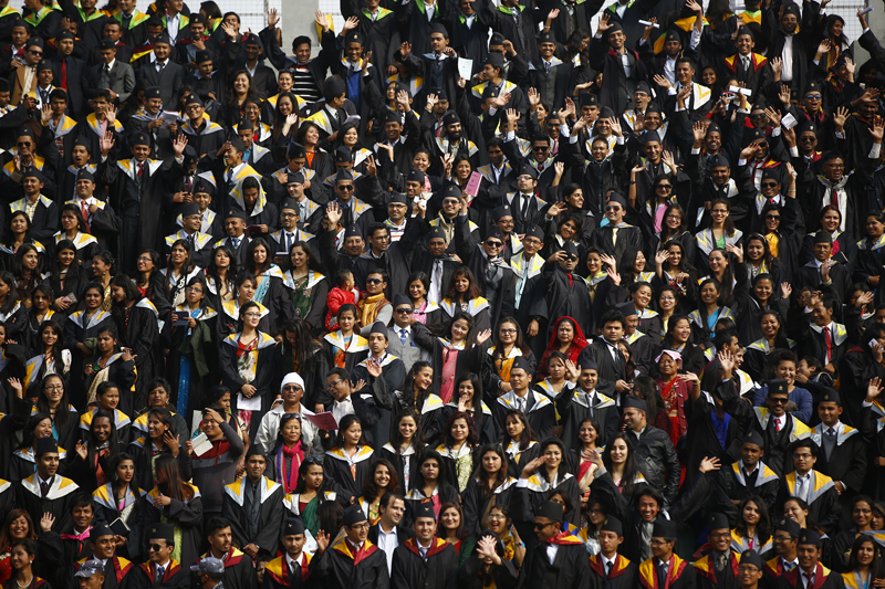 Students attend the 41st convocation ceremony of Tribhuvan University at Dashrath Stadium in Kathmandu, on Wednesday, December 2, 2015. More than 5,000 students from various faculties  attended the ceremony. Photo: Skanda Gautam