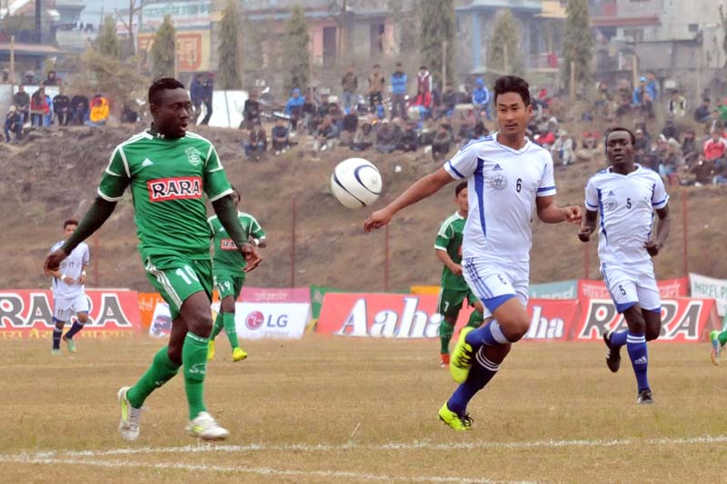 Players of Sahara Club and Navajagriti Youth Club vie for the ball during their match of the 14th Aaha-Rara Gold Club at the Pokhara Stadium on Tuesday, January 19, 2016.