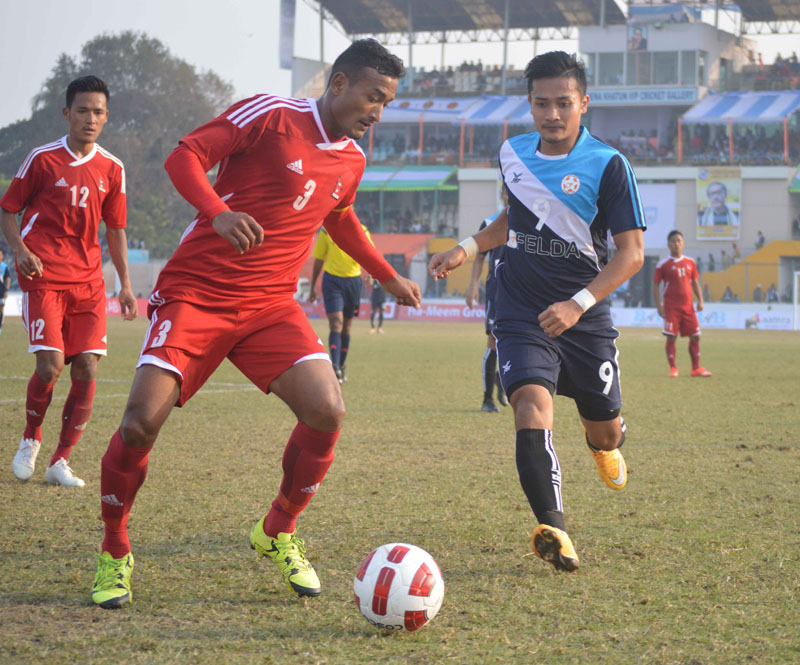 File- Nepal U-23 skipper Biraj Maharjan and Felda United's Bobby Gonzales vie for the ball during their nBangabandhu Gold Cup match in Jessore. Photo courtesy: ANFA