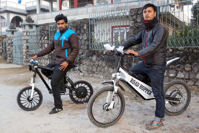Biraj Bhandari (right) and Amrit Sigdel, students of Gandaki College of Engineering, riding the self-made u2018Gangaraniu2019 bicycles to cope with the ongoing the fuel crisis in Phalepatan, Pokhara, on Friday, January 1, 2016. Photo: Bharat Koirala/ THT