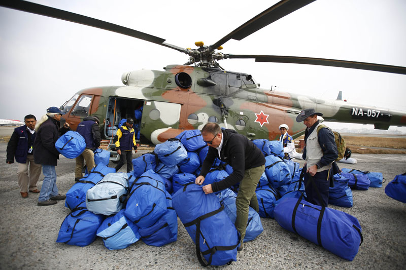 Staff of Samaritan's Purse arrange winter relief materials before loading them on a Nepal Army helicopter the at Tribhuvan International Airport in Kathmandu, for Helumbu, a village located in Sindhupalchok district on Thursday, January 21, 2016. Photo: Skanda Gautam