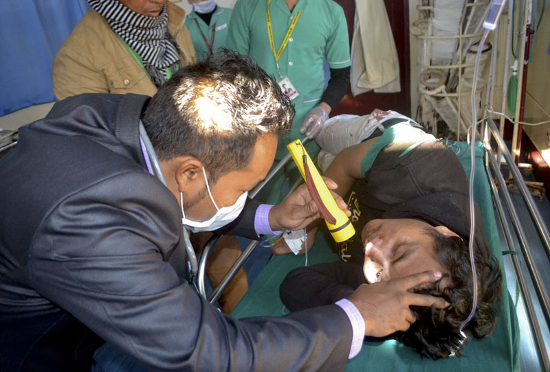 A doctor attends to a man who was injured after an earthquake at a hospital in Imphal, capital of the northeastern state of Manipur, India on Monday, January 4, 2016. Photo: AP