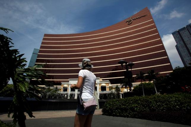 A visitor walks in front of the Wynn Macau resort in Macau June 5, 2012. REUTERS/Bobby Yip