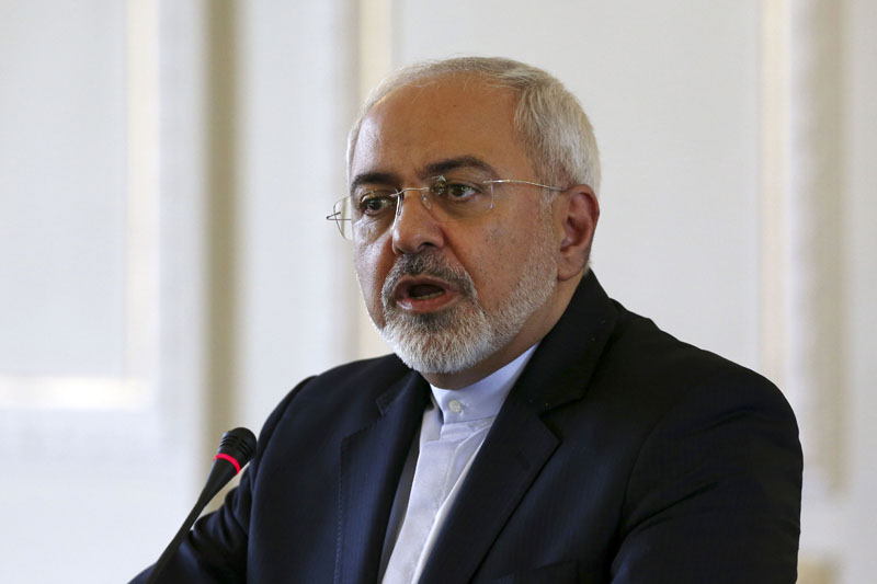 FILE - Iranian Foreign Minister Mohammad Javad Zarif speaks with media in a joint press conference with European Union foreign policy chief Federica Mogherini in Tehran, Iran on Tuesday, July 28, 2015.  Photo: AP