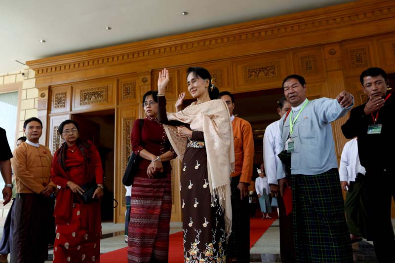 National League for Democracy (NLD) party leader Aung San Suu Kyi waves her hand to Shwe Mann speaker of the Union Parliament as he leaves after attending a farewell ceremony at the Parliament in Naypyitaw, on January 29, 2016. Photo: Reuters