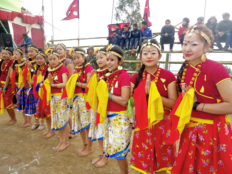 Girls dressed in traditional costumes wait to welcome players at the inauguration function of the International Invitition Maipokhari Gold Cup in Tundikhel of Ilam district on Friday, January 29, 2016. Photo: RSS