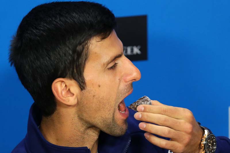 Novak Djokovic of Serbia eats a sweet during a press conference, ahead of the Australian Open tennis championships in Melbourne, Australia, on Sunday, January 17, 2016. Photo: AP