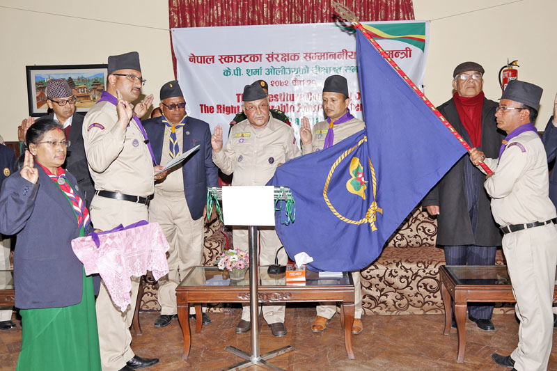 Chief Commissioner Rabindra Dahal of the Nepal Scout inducing Prime Minister KP Sharma Oli as Patron of the Nepal Scouts an investiture ceremony organised at its headquarters in Lainchaur, Kathmandu, on Tuesday, January 05, 2016. Photo: RSS