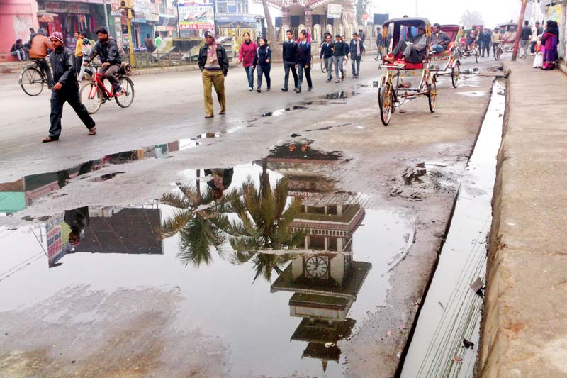 Pedestrians walking on the streets near Ghantaghar of Birgunj after the protest of the United Democratic Madhesi Front (UDMF) cooled down their protest following a rainfall, on Thursday, January 21, 2016. Photo: Ram Sarraf/ THT