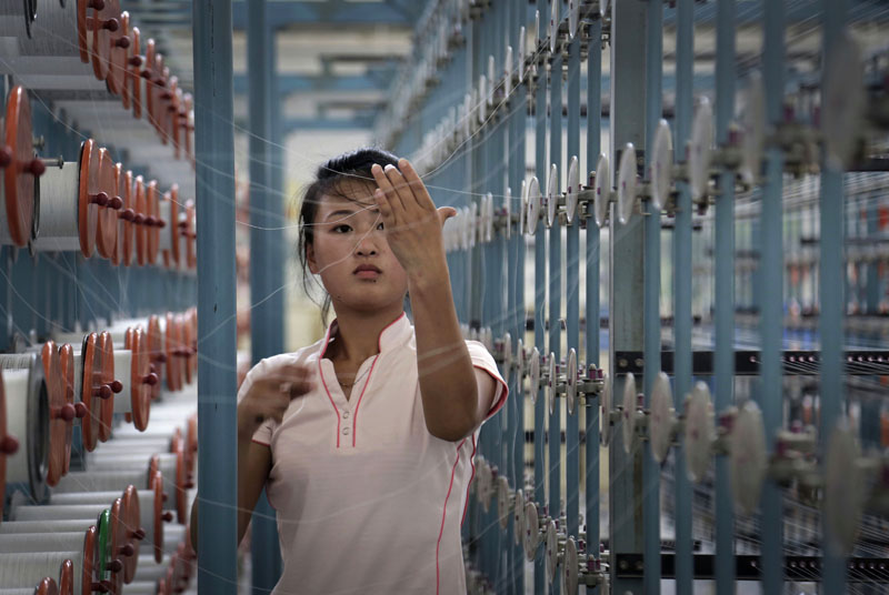 FILE - A North Korean woman works at the Kim Jong Suk Pyongyang textile factory, in Pyongyang, North Korea on Thursday, July 31, 2014. Photo: AP