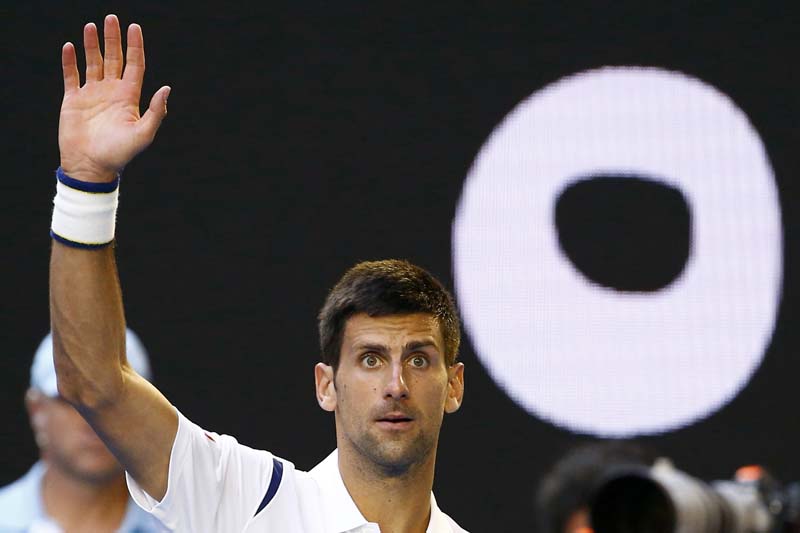 Serbia's Novak Djokovic waves to the crowd after winning his fourth round match against France's Gilles Simon at the Australian Open tennis tournament at Melbourne Park, Australia, on January 24, 2016. Photo: Reuters