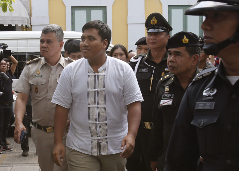 Sirawich Serithiwat, also known as u0093Ja Newu0094 centre arrives at military court in Bangkok, Thailand, on Thursday, January 21, 2016. Photo:  AP