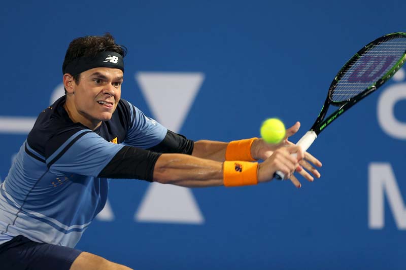 Milos Raonic of Canada returns the ball to Rafael Nadal of Spain during the final match of Mubadala World Tennis Championship in Abu Dhabi, on January 2, 2016. Photo: Reuters
