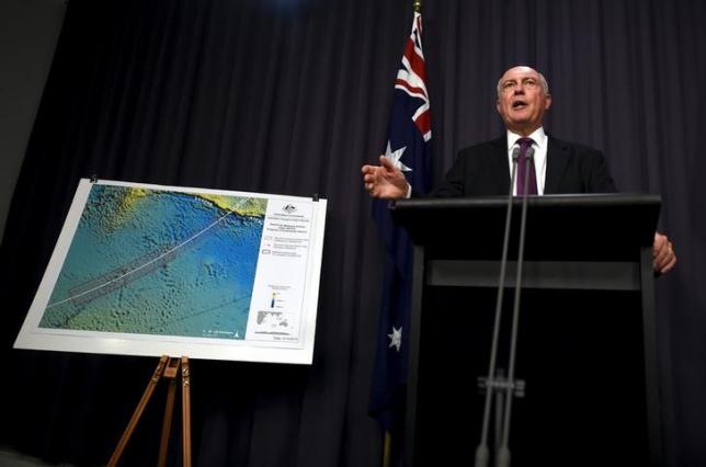 Australia's Deputy Prime Minister Warren Truss speaks during a media conference next to a map displaying the search area for missing Malaysia Airlines Flight MH370 at Parliament House in Canberra, Australia, December 3, 2015. REUTERS/Lukas Coch/AAP