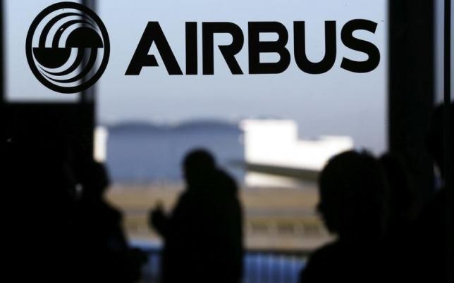 People are silhouetted past a logo of the Airbus Group during the Airbus annual news conference in Colomiers, near Toulouse January 13, 2015.   REUTERS/Regis Duvignau