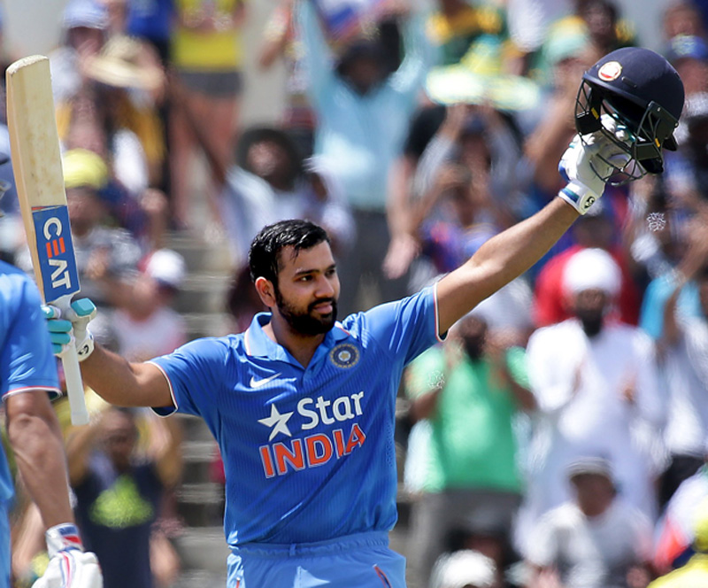 India's Virat Kohli (L) watches as teammate Rohit Sharma celebrates after reaching his century during their One Day International cricket match against Australia in Perth January 12, 2016.     REUTERS/Bill Hatto