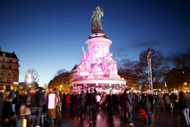 People gather at Place de la Republique square to pay tribute to the victims of last year's shooting at the French satirical newspaper Charlie Hebdo, in Paris, France, January 10, 2016.  Photo: Reuters