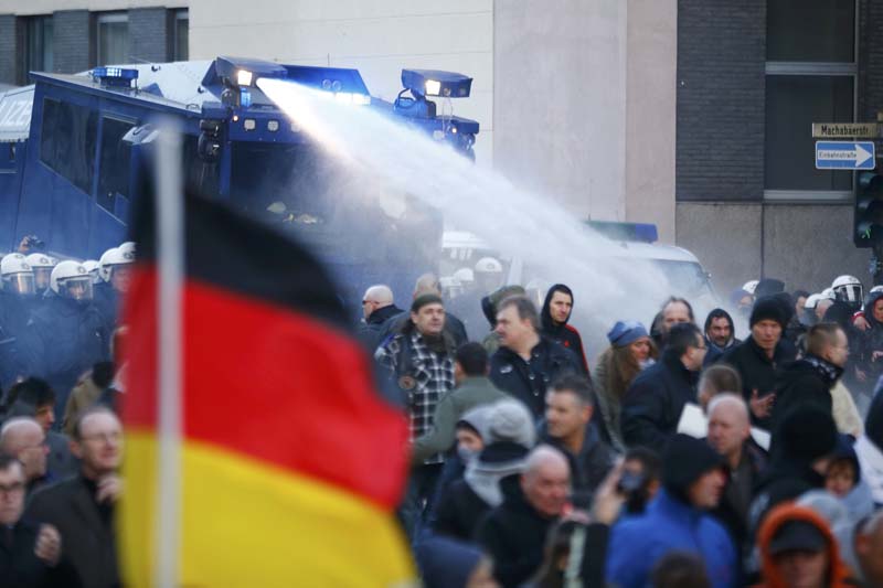 Police use a water cannon during a protest march by supporters of anti-immigration right-wing PEGIDA movement in Cologne, Germany, on January 9, 2016. Photo: Reuters