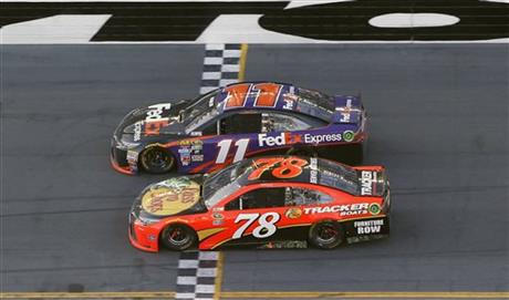 Denny Hamlin (11) beats out Martin Truex Jr. (78) at the finish line to win the NASCAR Daytona 500 auto race at Daytona International Speedway, Sunday, Feb. 21, 2016, in Daytona Beach. Photo: AP