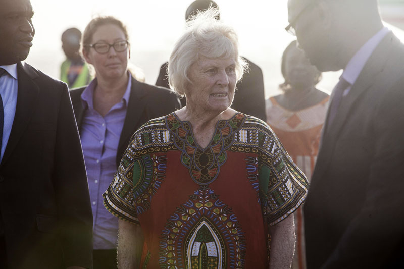 Australian Jocelyn Elliott (centre), who was freed by al-Qaida captors, walks after getting off an airplane at the airport in Ouagadougou, Burkina Faso, on Monday, February 8, 2016.  Photo: AP