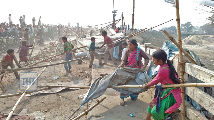 Locals and traders remove structures set by protesters to open the Nepal-India border in Birgunj of Parsa