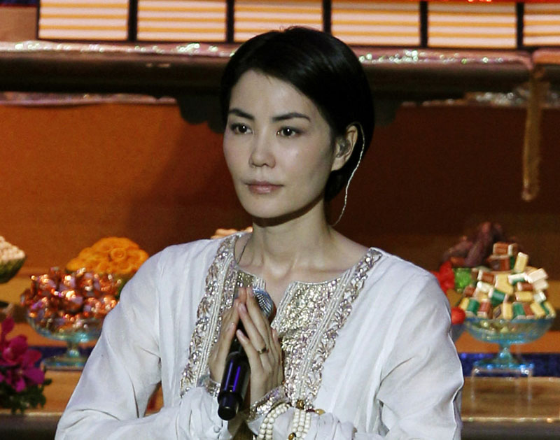FILE - Chinese pop singer Faye Wong, also known as Wang Fei, performs during the opening ceremony of the third World Buddhist Forum in Hong Kong, on April 26, 2012. Photo: AP