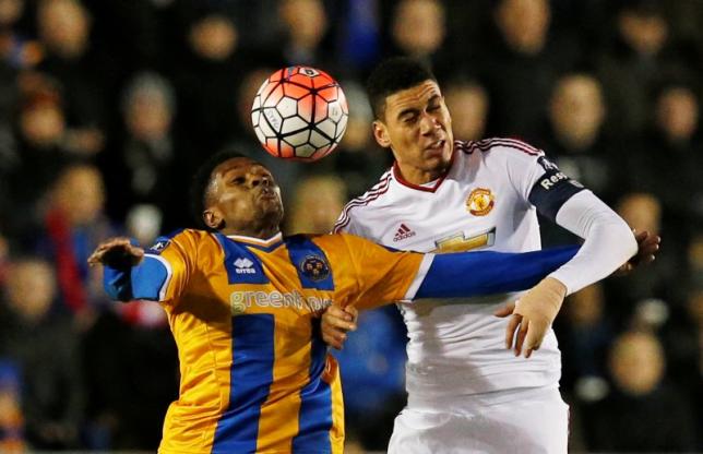 Manchester United's Chris Smalling in action with Shrewsbury Town's Jean-Daniel Akpa AkpronReuters / Andrew YatesnLivepic