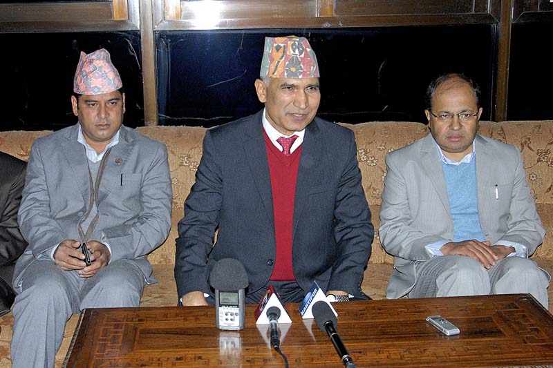 Finance Minister Bishnu Paudel interacting with the mediapersons at the Tribhuvan International Airport (TIA) before departing to India, on Sunday, February 7, 2016. Photo: THT