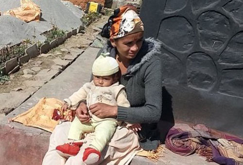 Laxmi Sunar with her infant Bindu in Jajarkot district, on Thursday, February 18m 2016. The child is forced to live in prison as there is no one to take care of her in the family. Photo: Dinesh Kumar Shrestha