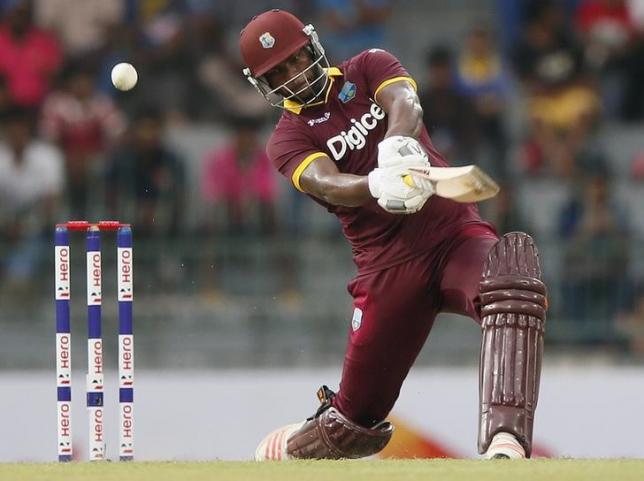 West Indies' Johnson Charles hits a boundary during their second One Day International cricket match against Sri Lanka in Colombo November 4, 2015. REUTERS/Dinuka Liyanawatte/Files