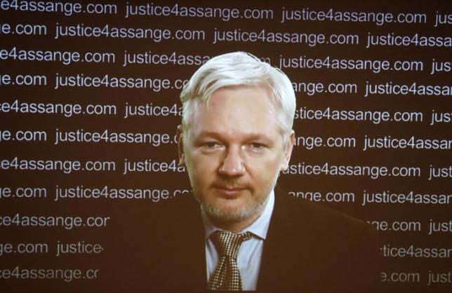 WikiLeaks founder Julian Assange appears on screen via video link during a news conference at the Frontline Club in London, Britain February 5, 2016. REUTERS/Neil Hall