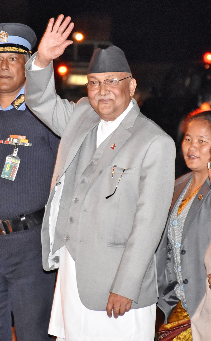 Prime Minister KP Sharma Oli waves hand upon his arrival at Tribhuvan International Airport from six-day state visit to India on Wednesday, February 24, 2016. Photo: Naresh Krishna Shrestha/ THT