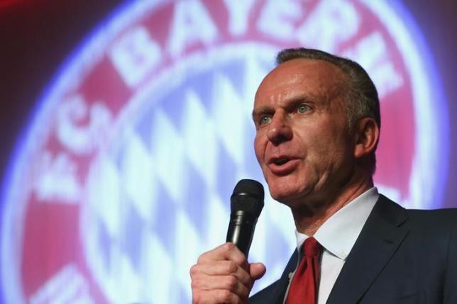 Bayern Munich CEO Karl-Heinz Rummenigge speaks at the team's after-match party in Berlin May 18, 2014. REUTERS/Alexander Hassenstein/Pool/Files