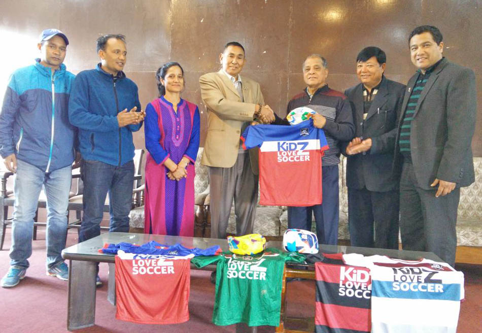 Kidz Love Soccer representatives handing over football equipment to ANFA. Photo: ANFA