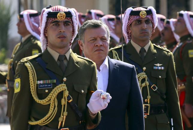 Jordan's King Abdullah II (2nd L) reviews an honour guard during celebrations marking the centennial of the Arab Revolt against the region's then ruling Ottoman Turks, in Jordan's Red Sea port of Aqaba, January 23, 2016. REUTERS/Raad Adayleh, Pool