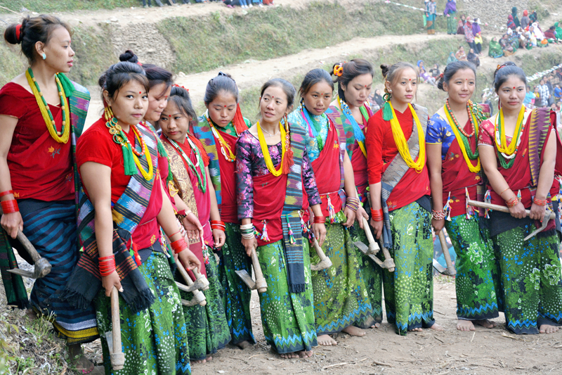 Clad in traditional attire, members of the Magar Community posing for a group photograph in Baglung on Tuesday, February 16, 2016. Photo: RSS