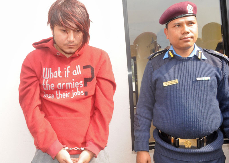 Kirtan Khadgi aka Satish (25), nabbed on charge of murdering a girl for sex denial, being paraded at the Kaski District Police Office, in Pokhara, on Monday, February 8, 2016. Photo: Bharat Koirala