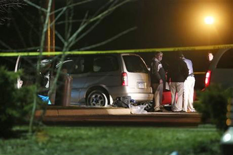 Police investigate the scene early Sunday, Feb. 21, 2016, where people were shot in vehicles outside a Cracker Barrel restaurant in Kalamazoo, Mich. A man drove around Kalamazoo shooting people at three locations Saturday, leaving six dead and three injured, two of them critically, police said. Police have arrested the suspect in the Saturday, Feb. 20, multiple shootings. AP