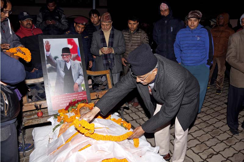 Narahari Acharya, Central Working Committee member of the Nepali Congress (NC), paying respects to the body of Nepali Congress President and former Prime Minister Sushil Koirala at Koirala residence in Maharajgunj, on Tuesday, February 9, 2016. Photo: RSS