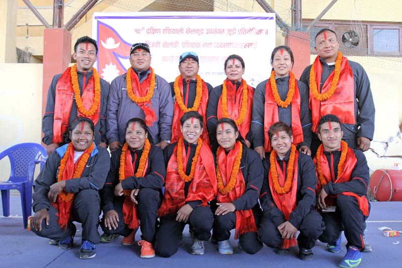 The 12th South Asian Games medal winning judo players and officials pose for a group picture after being felicitated by Nepal Judo Association at the Olympian semi-covered hall in Tripureshwor, Kathmandu on Tuesday, February 23, 2016. Photo: Udipt Singh Chhetry/ THT