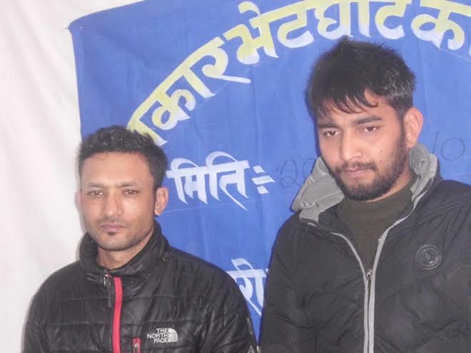 Prakash Dahal (R) and Meghnath Giri (L) nabbed for swindling people of millions of rupees by using mobile phone. Photo: Laxmi Gautam 