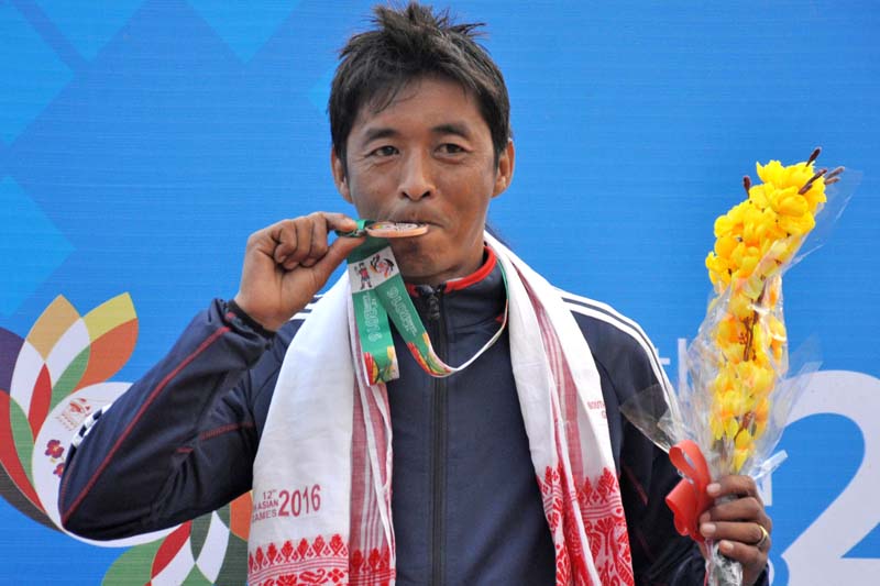 Archery player Prem Prasad Pun holds bronze medal after their competitions in the 12th South Asian Games on Tuesday, February 9, 2016.