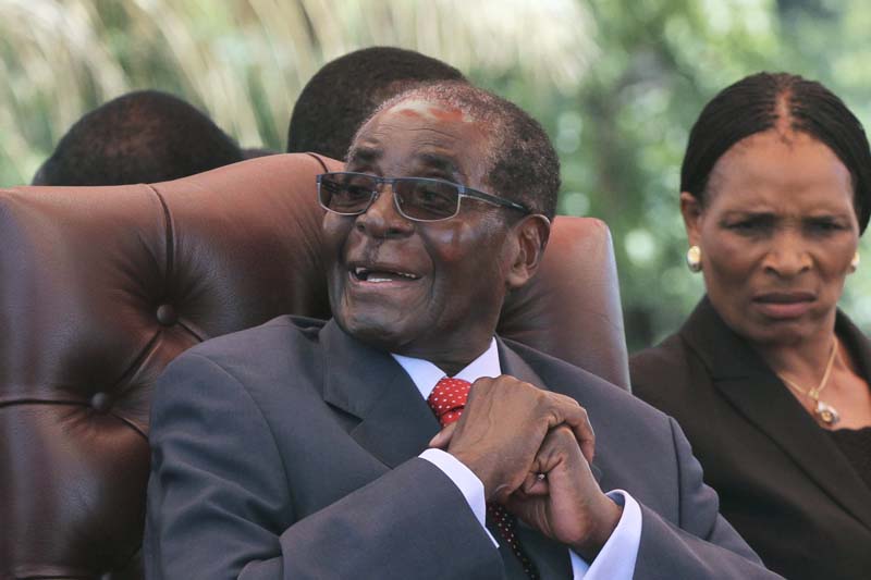 Zimbabwe's President Robert Mugabe laughs before addressing the ZANU-PF party's top decision making body, the Politburo, in the capital Harare, on February 10, 2016. Photo: Reuters