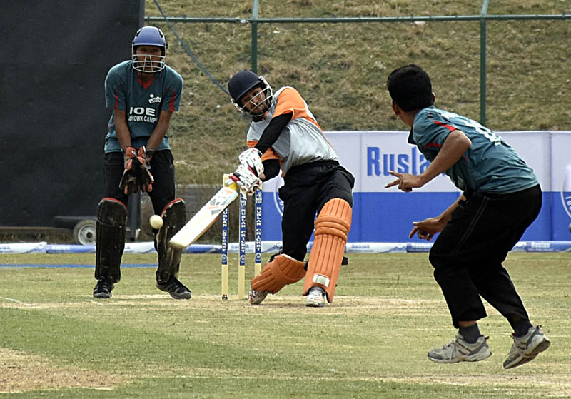 Nepal APF's Pradeep Airee plays a shot against Institute of Engineering during their first Ruslan Cup Cricket Tournament match at the TU Stadium in Kathmandu on Sunday. Photo: NARESH KRISHNA SHRESTHA/THT