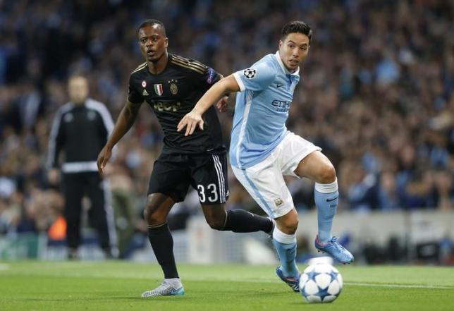 Football - Manchester City v Juventus - UEFA Champions League Group Stage - Group D - Etihad Stadium, Manchester, England - 15/9/15nJuventus' Patrice Evra in action with Manchester City's Samir NasrinAction Images via Reuters /Carl Recine/Livepic/Files