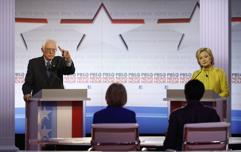 Democratic presidential candidate, Sen. Bernie Sanders, I-Vt (left) speaks as Hillary Clinton listens during a Democratic presidential primary debate at the University of Wisconsin-Milwaukee, on Thursday, February 11, 2016, in Milwaukee. Photo: AP